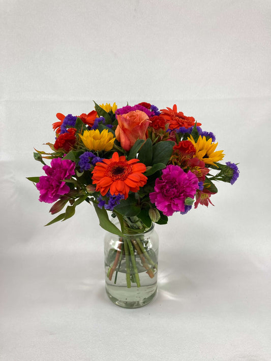 Bright posy consisting of orange, yellow, red, purple, and green flowers