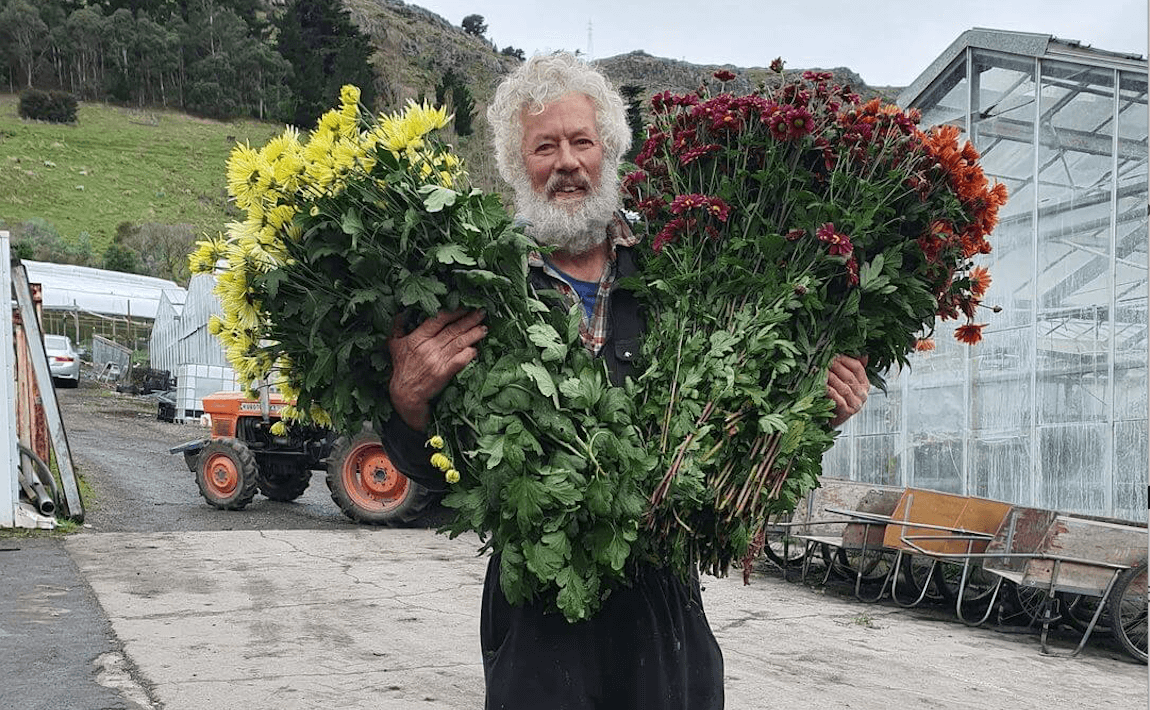 flower farmer holding flowers for delivery