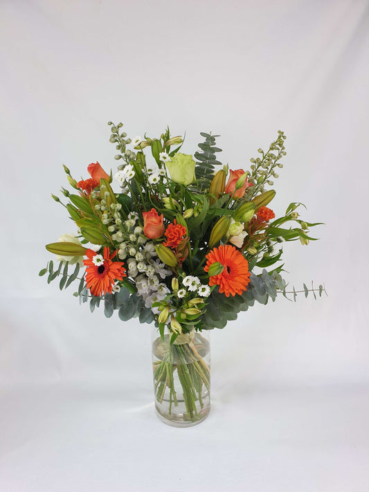 An orange, white, and green bouquet.