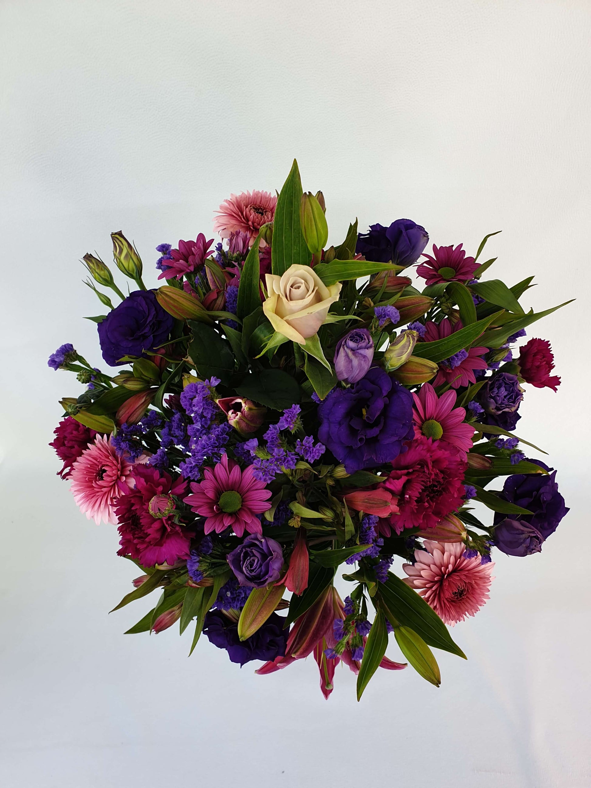 A pink and purple bouquet from above.