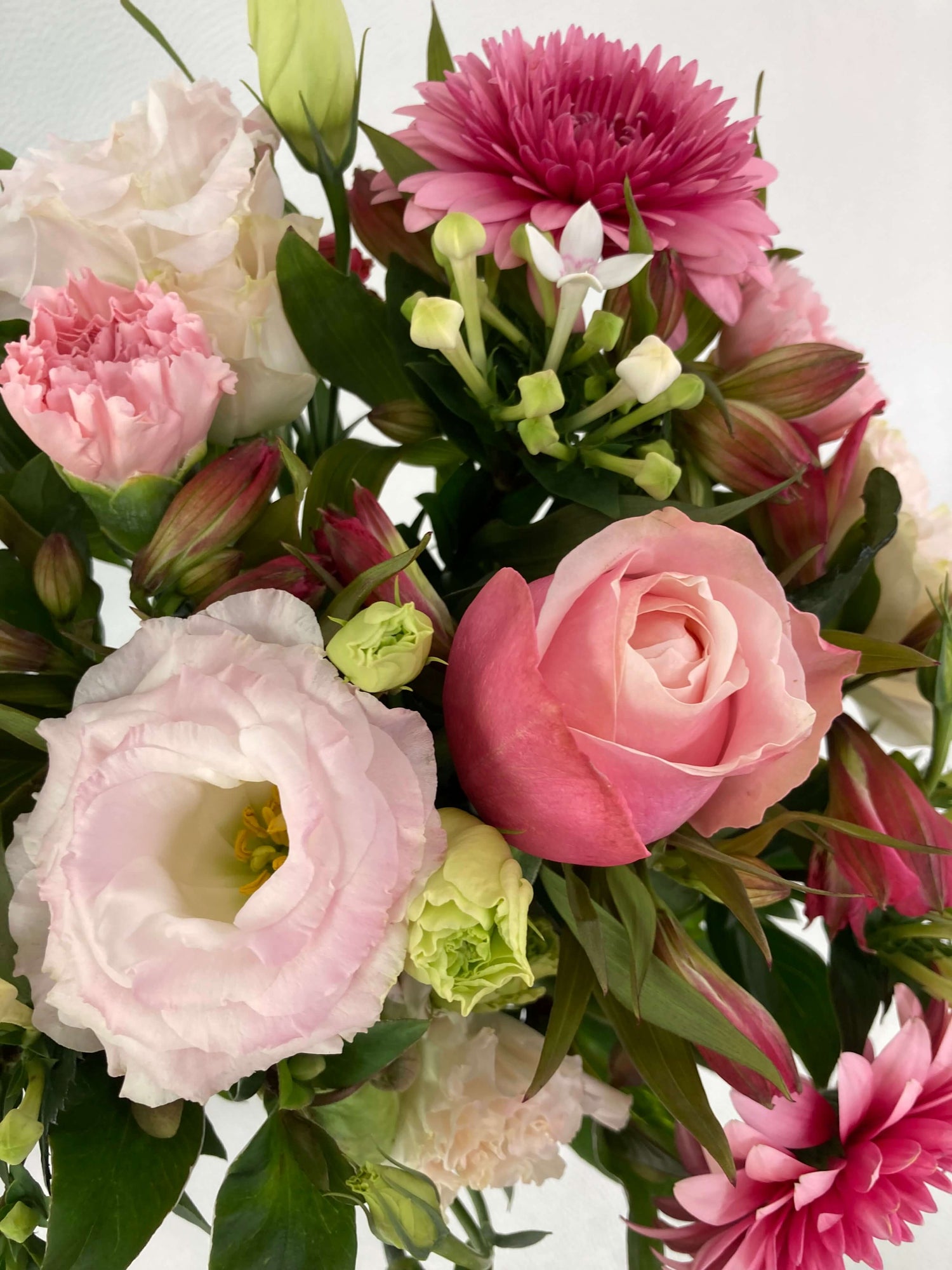 We use pink roses in our thank you arrangements because they signify thankfulness.