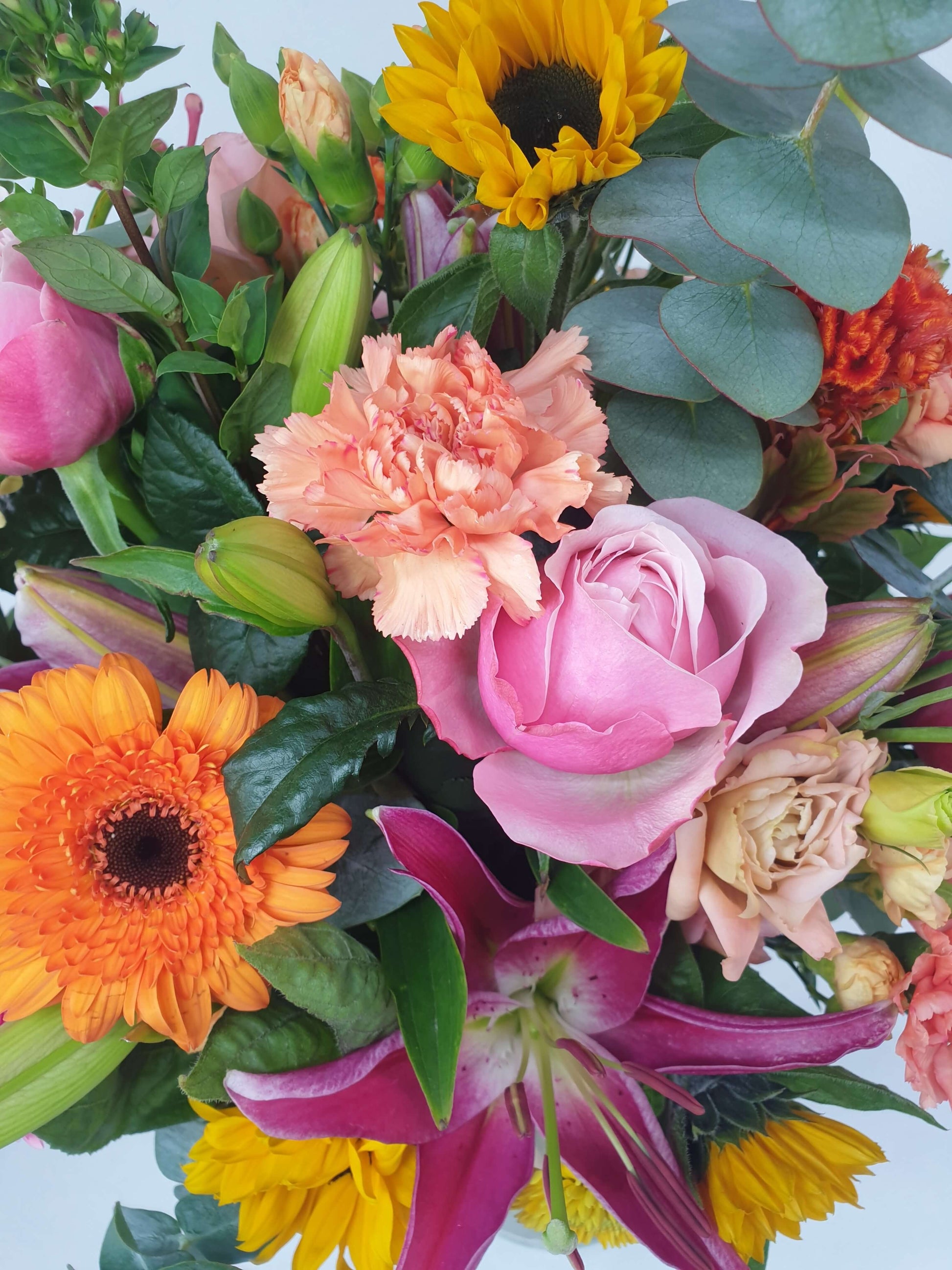 pink, orange, and yellow flowers that we sell.