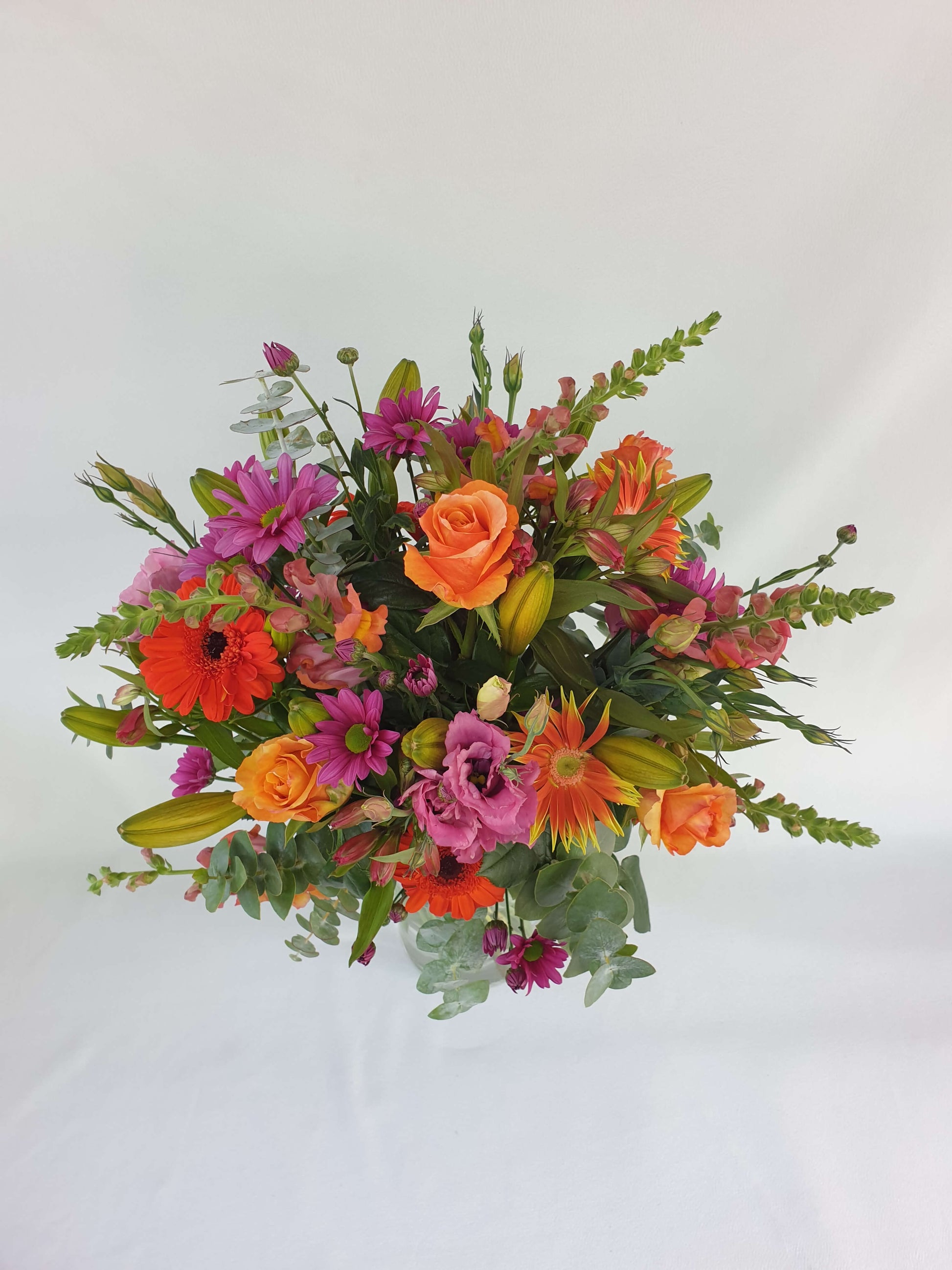 A pink and orange bouquet from above.