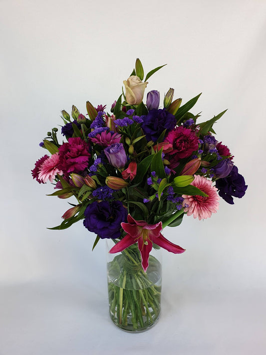 pink and purple bouquet of long-stemmed flowers