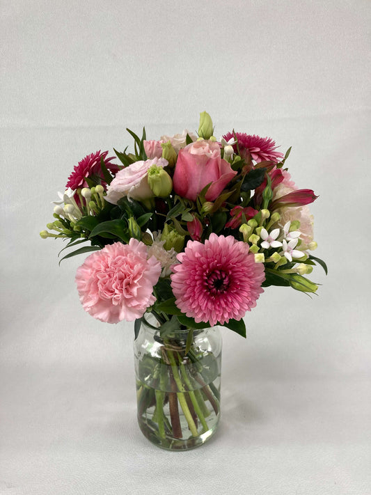 Pink flower arrangement made by our qualified florists