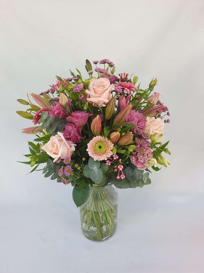 Our pink bouquet features pink lilies.