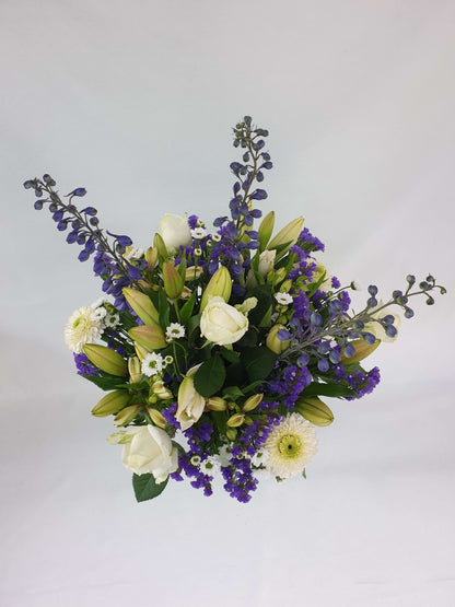 White and purple bouquet from above.