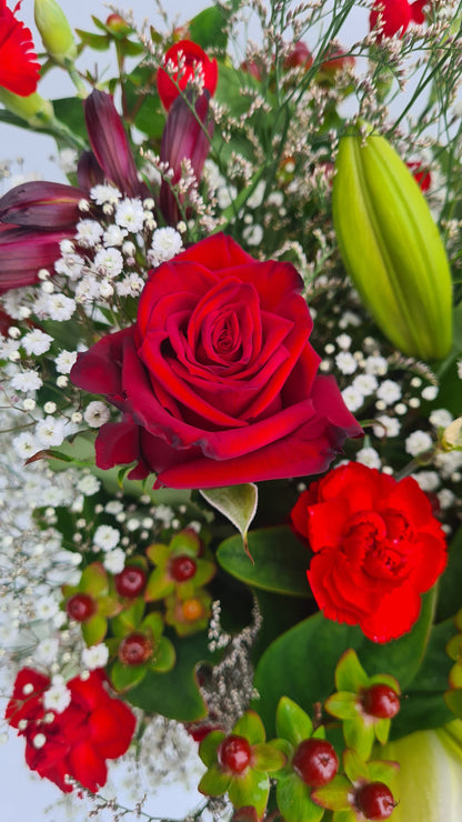 Bouquet of red roses and other flowers with a clear background