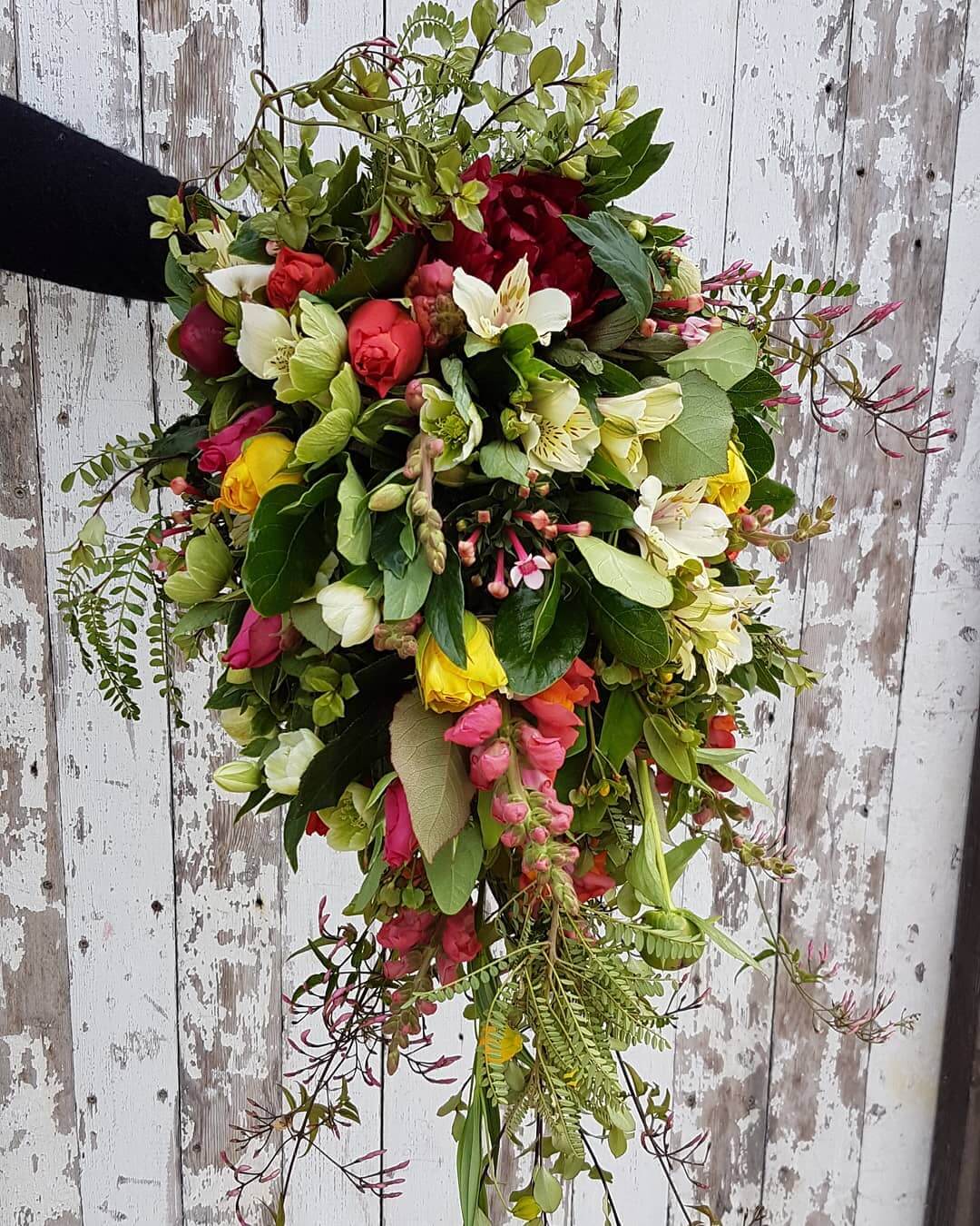 Red, yellow, and green bridal bouquet