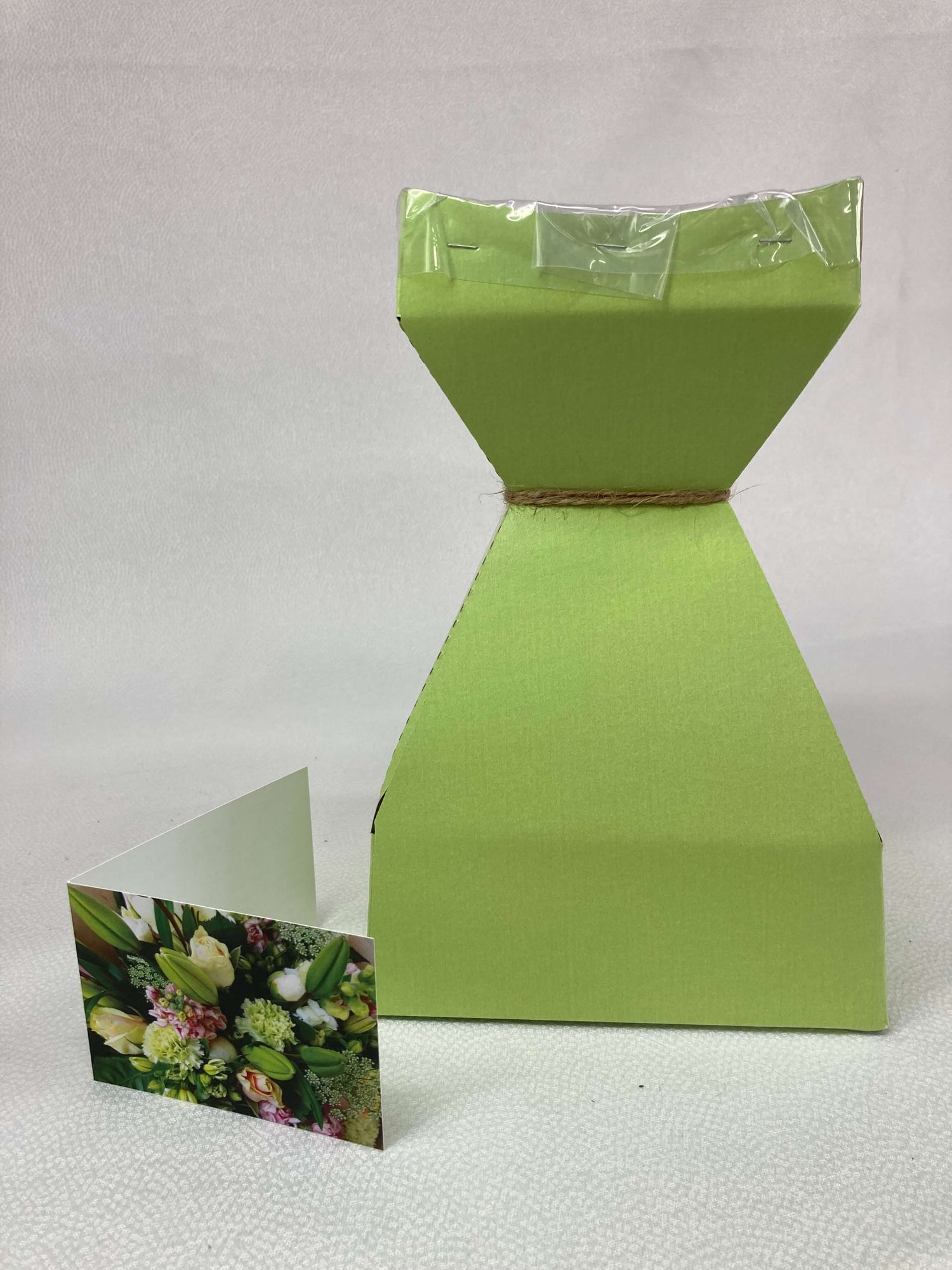 Water-filled box to preserve flowers when a vase isn't readily available. Picture also shows our complimentary cards we include with every order for your personal note.